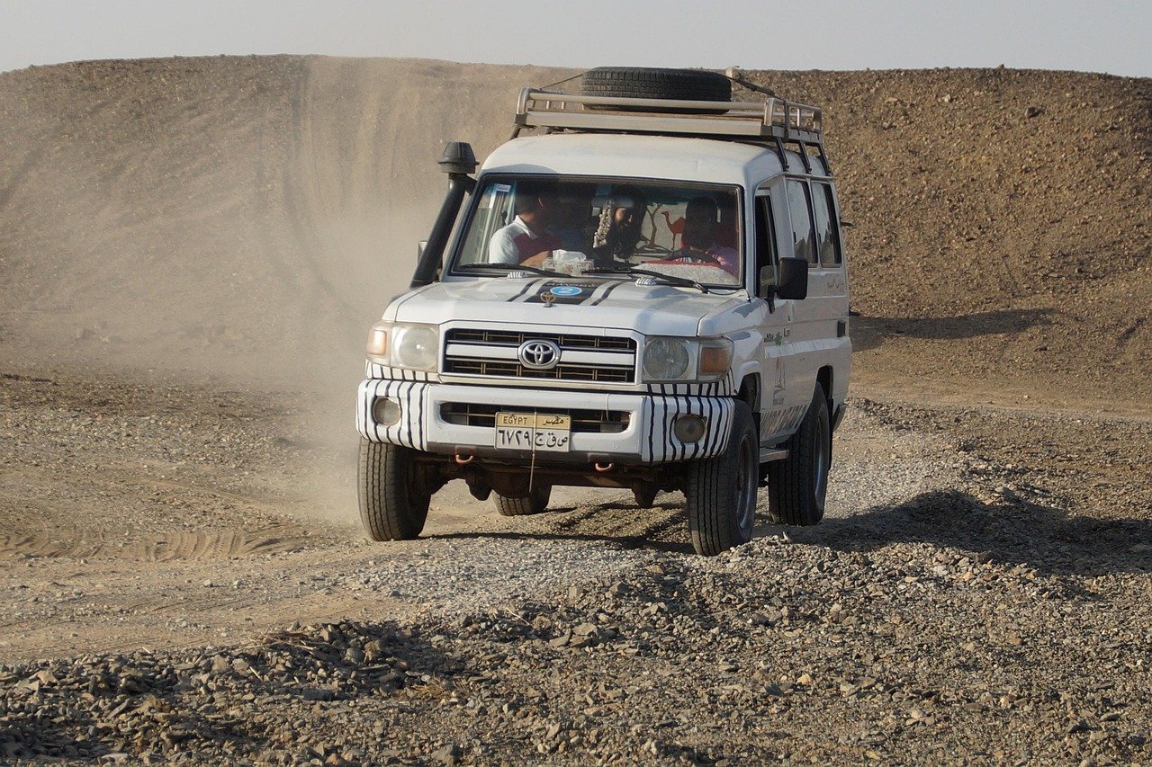 Travelers driving 4x4 during self-drive desert safari in Dubai