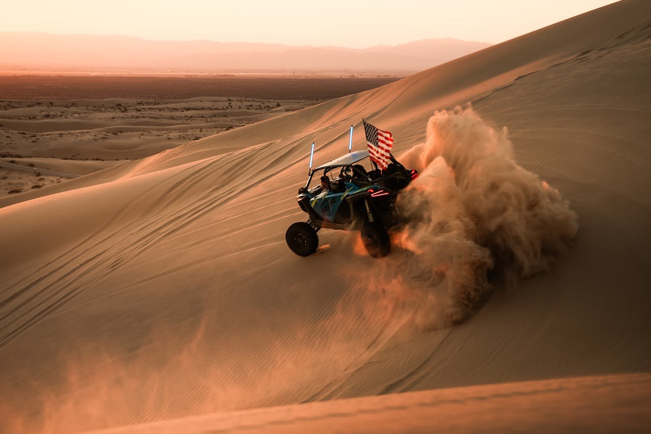 Desert safari with dune buggy from Dubai Marina riding across Lahbab red dunes in 2025