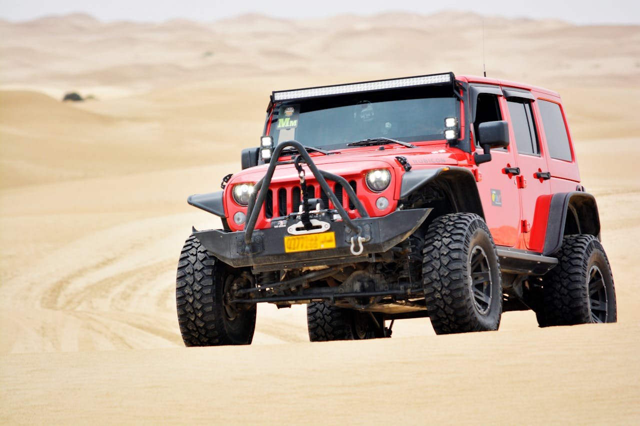 Can-Am Maverick X3 climbing Dubai red dunes in Lahbab desert