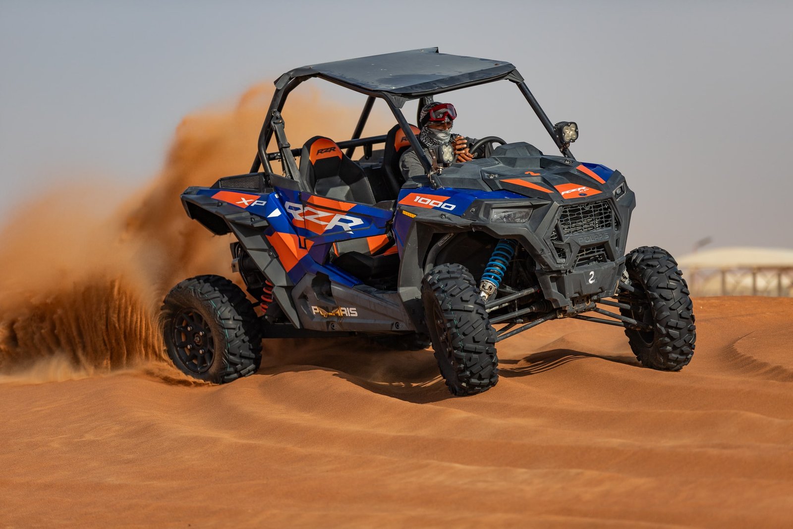 Dune Buggy Dubai | Self-Drive Tours at Lahbab Red Dunes 11 Polaris RZR 1000 two-seater dune buggy on the red dunes in Dubai
